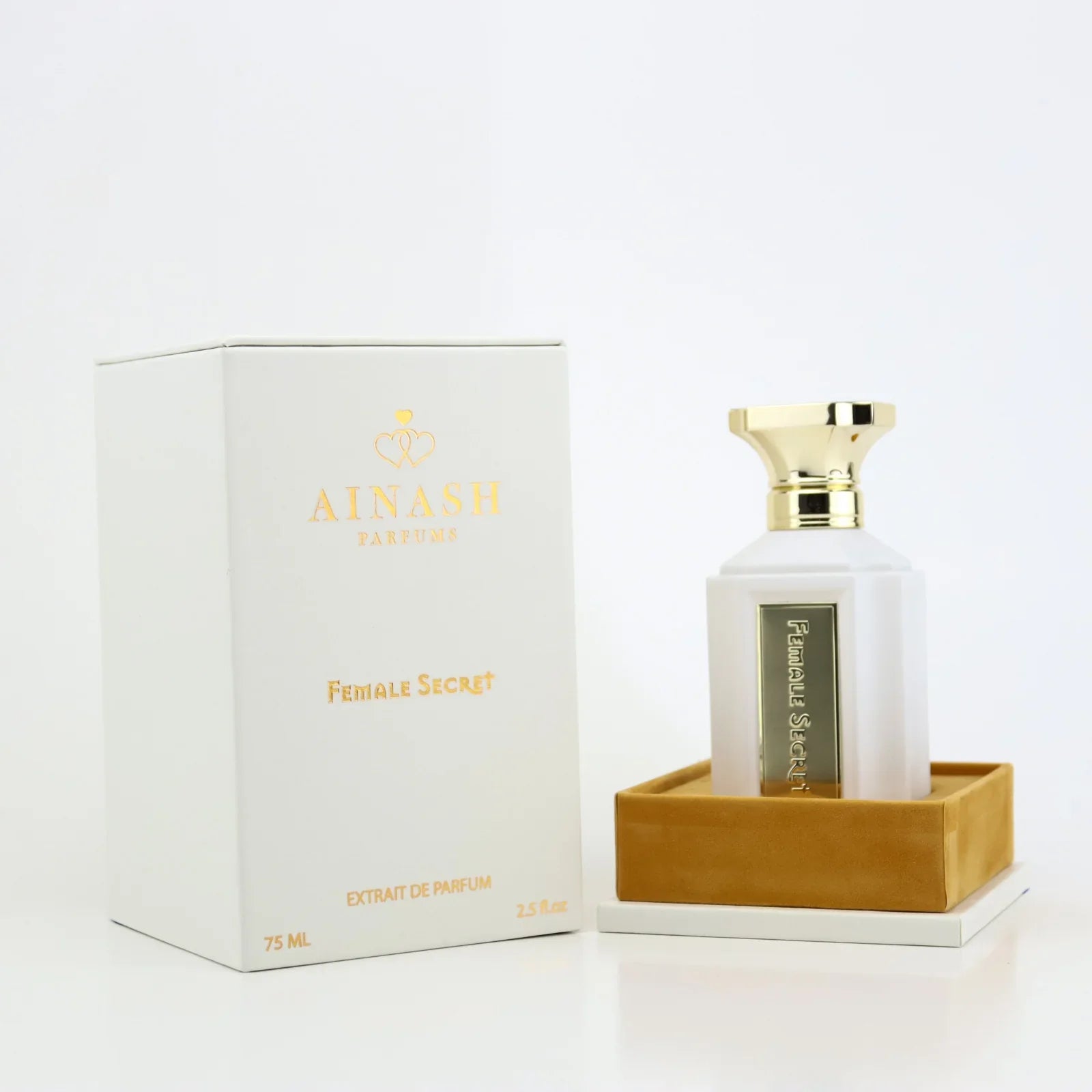 A bottle of Ainash Female Secret 2.5 Edp with its packaging box, both displaying the product and the brand name.