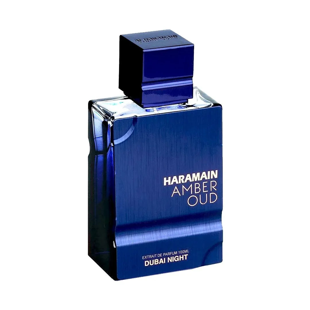Blue perfume bottle labeled 'Haramain Amber Oud Dubai Night' on a white background