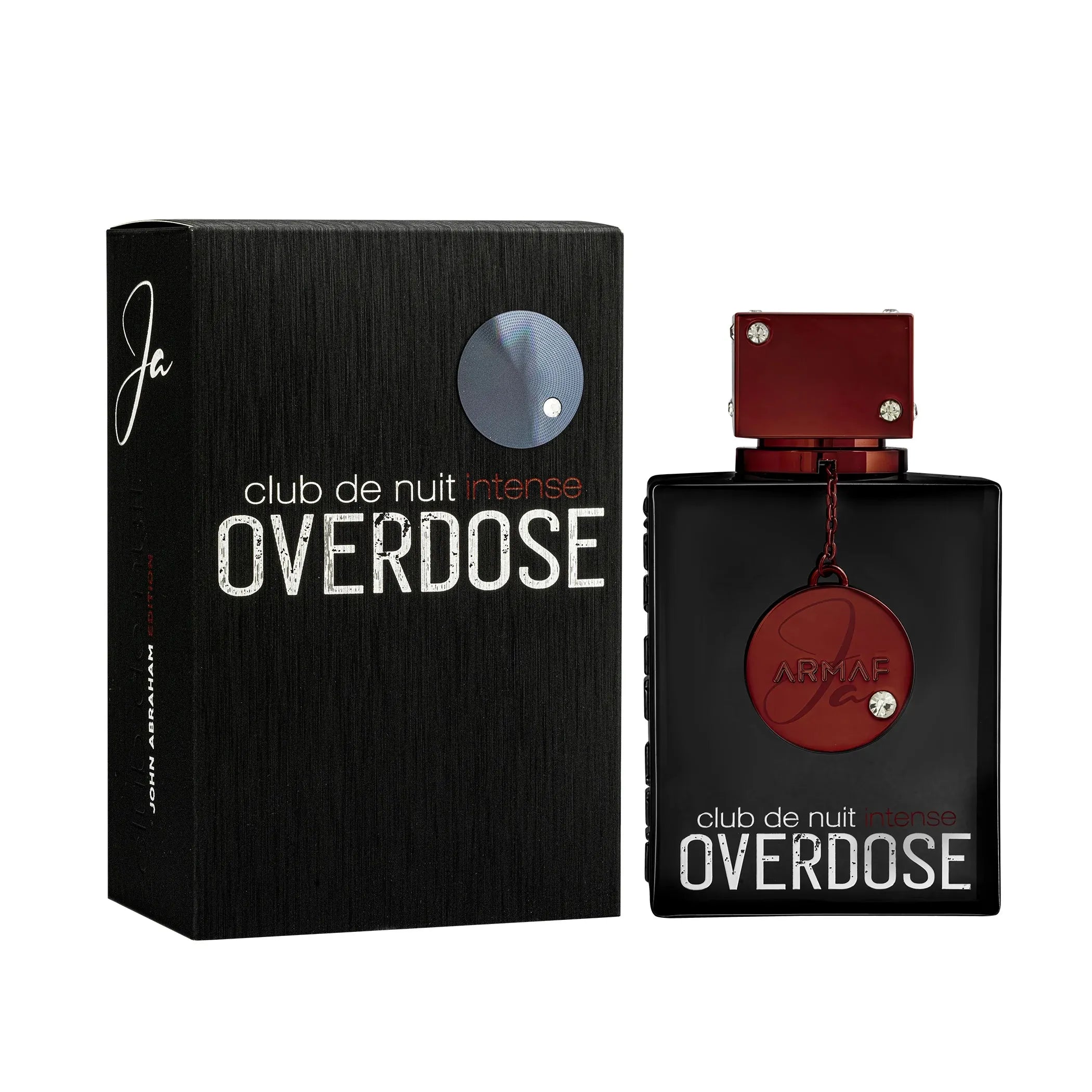 Club de Nuit Intense Overdose perfume shown with its black textured box and the rectangular bottle. The bottle has a black body, a metallic red cap, and a red circular medallion with the brand name 'AIRNAIT'.