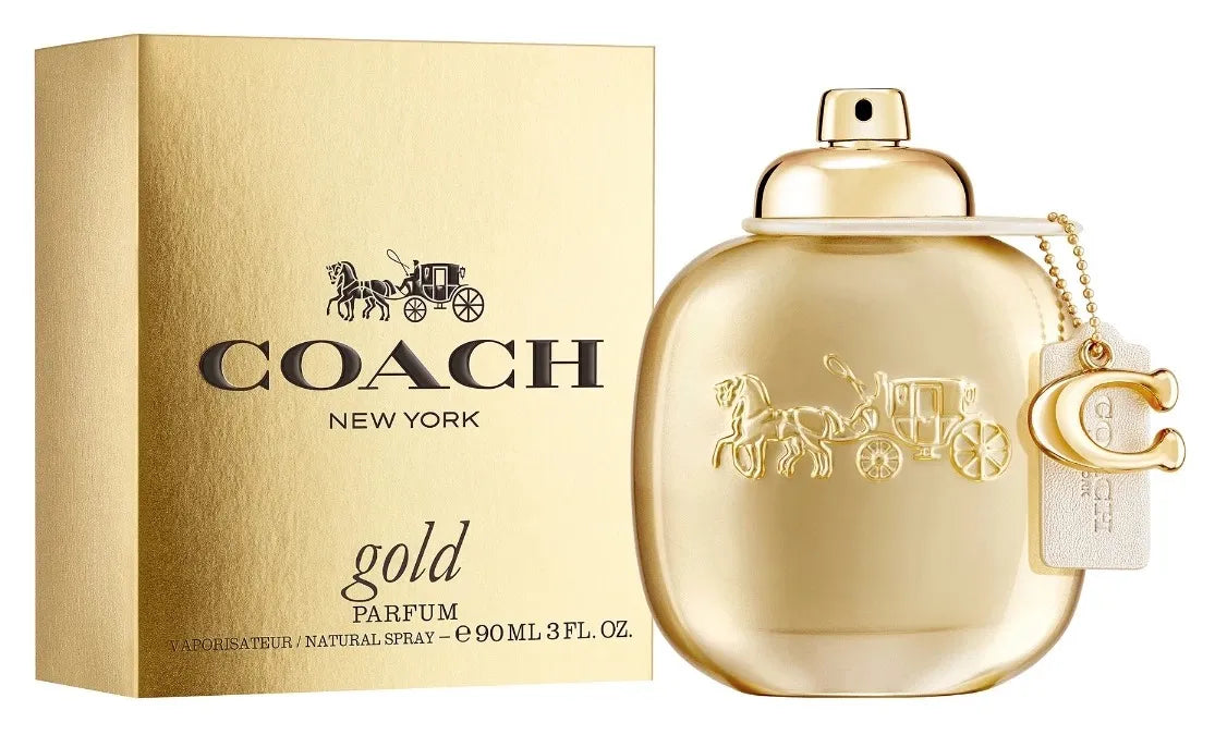 Coach New York gold parfum bottle and packaging on a white background