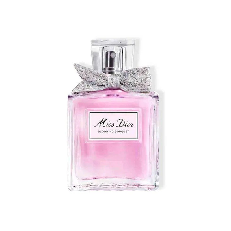 Miss Dior Blooming Bouquet perfume bottle with pink liquid and silver cap on a white background