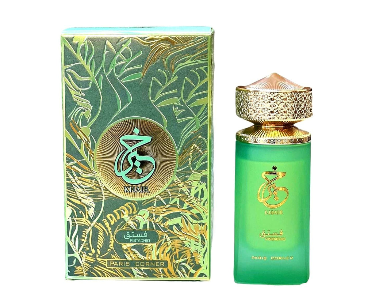 Green perfume bottle with gold accents and matching box on a white background