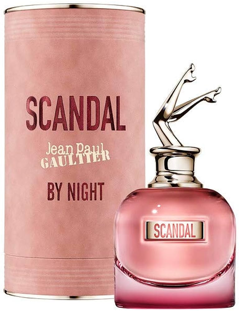 Pink 'Scandal' perfume bottle and packaging by Jean Paul Gaultier on a white background
