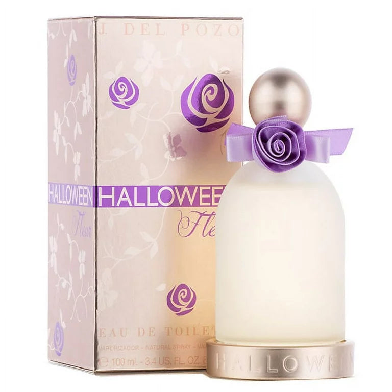 Jesus Del Pozo Halloween Fleur eau de toilette in a clear glass bottle with a purple cap, alongside its pink and gold box packaging.