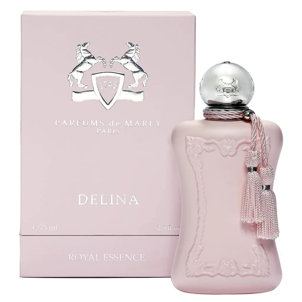 Pink perfume bottle with silver cap and tassel next to its packaging box, featuring 'Parfums de Marly' branding.