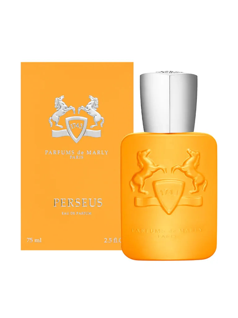 Orange perfume bottle with silver cap and Parfums de Marly packaging on a white background